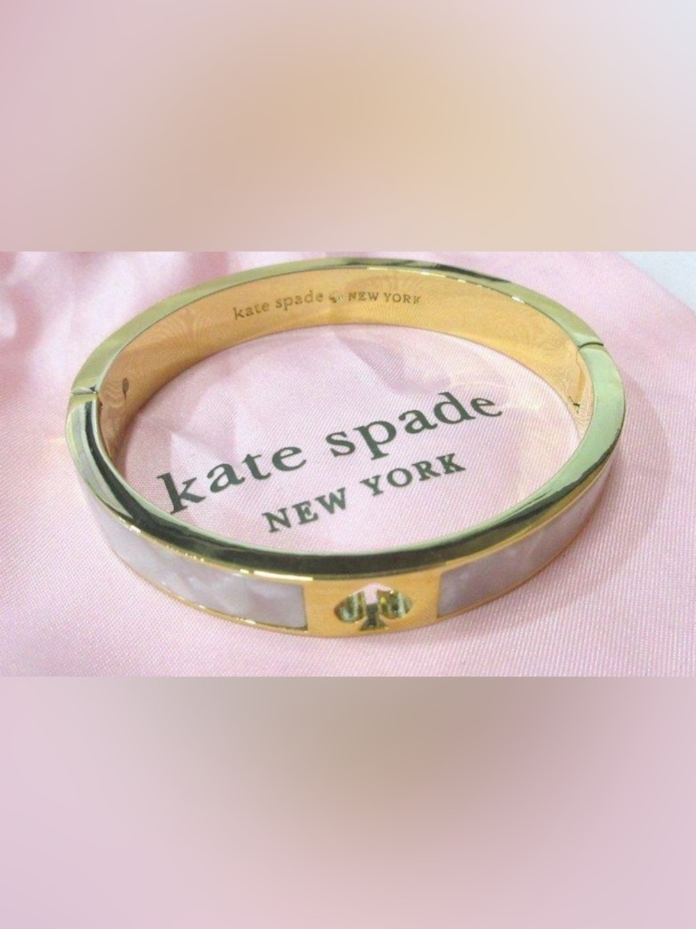 Kate Spade gold and white enamel hinges bangle bracelet